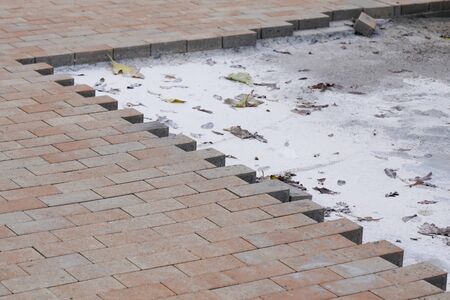 Repair work on city street paving brick with self-locking blocksの写真素材
