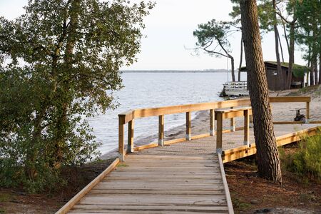 Wood access path boards to beach lake sea of Maubuisson Carcans Franceの写真素材