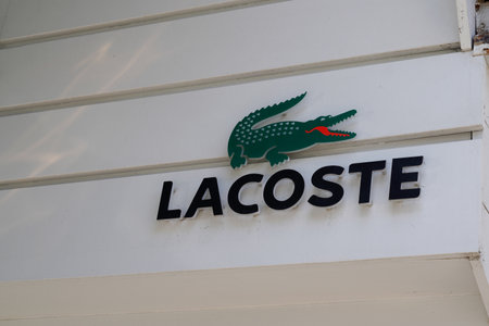 Bordeaux , Aquitaine / France - 02 15 2020 : Lacoste crocodile logo closeup of shop sign on store frontのeditorial素材