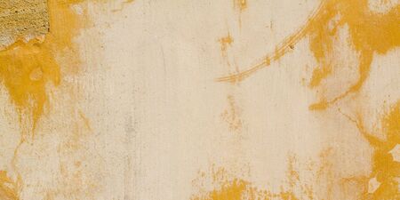 concrete beige wall with old plaster chipped texture background external decoration building facade