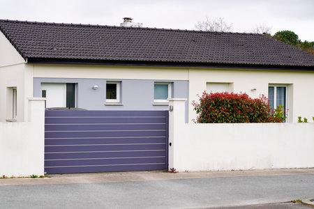 Metal grey driveway entrance gates house access garage in suburb