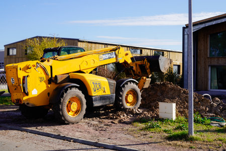 Bordeaux , Aquitaine / France - 03 03 2020 : JCB wheeled backhoe yellow excavator loader machine in...