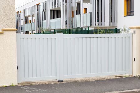 metal gate white grey home fence on suburb street house