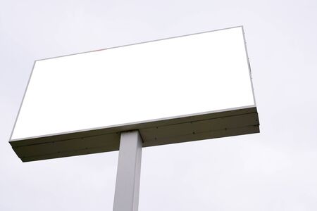 blank white billboard against cloudy skyの写真素材