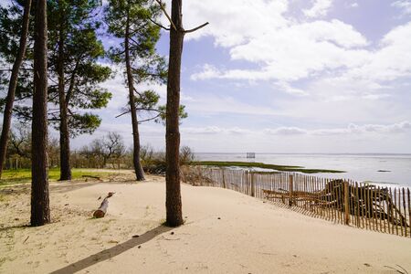 sandy beach in sunrise blue water winter on bay bassin arcachon in Gironde france