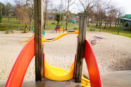 yellow slide in a children playground emptyの写真素材