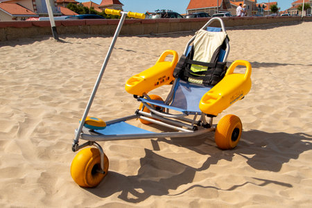 Bordeaux , Aquitaine / France - 03 03 2020 : Tiralo bathing wheelchair for people with disabilities in sand beachのeditorial素材