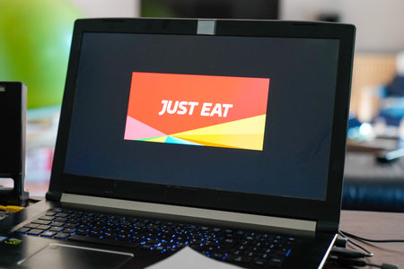 Bordeaux , Aquitaine / France - 03 03 2020 : just Eat sign logo computer laptop home application food deliveryのeditorial素材