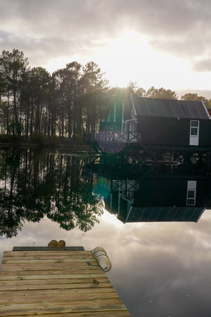 sunrise on wooden pontoon lake in Marina of Talaris in Lacanau villageのeditorial素材