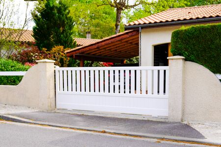 Aluminum white steel gate portal of suburb houseの写真素材