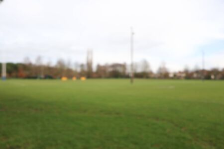 Blurred focus football green stadium empty blurry backgroundの写真素材