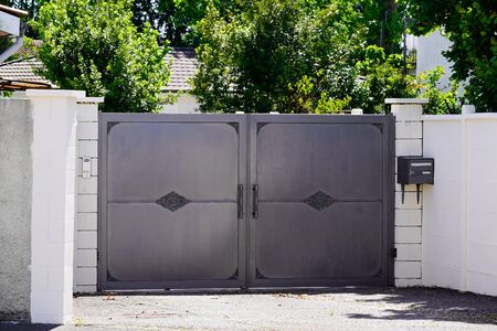 grey panel brut steel metal house portal of a traditional european houseの写真素材