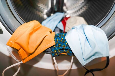 coronavirus textile mask into the washing machineの写真素材