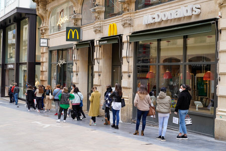 Bordeaux , Aquitaine / France - 05 12 2020 : people queue waiting for shopping on sidewalk outside shop  zara Mc Donalds during quarantine for COVID-19 virus in Bordeaux cityのeditorial素材