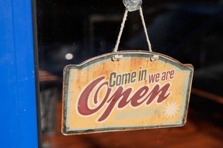 wooden open sign board wood on windows shop restaurant cafe store Open signboardの写真素材