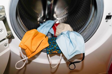 coronavirus textile fabric mask into the washing machineの写真素材