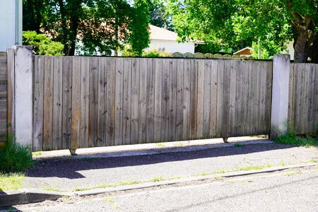 Brown natural wooden gates of private house