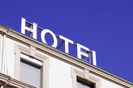 Hotel sign text on roof Building in tourist city