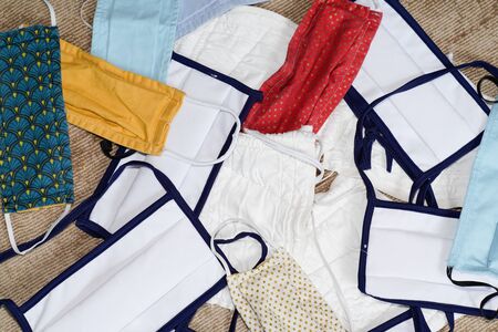 overproduction of different types of textile face masks protection for coronavirus prevention...