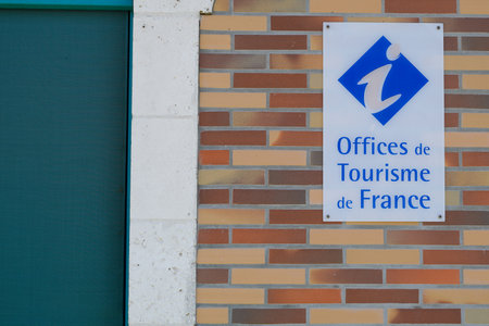 office de tourisme logo sign on wall building of information center in french for tourist tour helpのeditorial素材