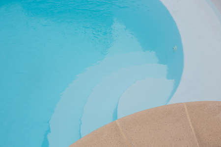 Blue steps stairway on swimming-pool stairs of private pool at home gardenの写真素材