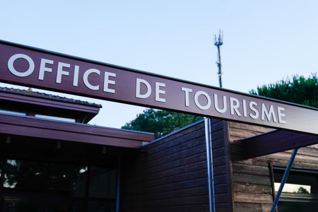 office de tourisme sign text in French means tourism office on wall agency in Franceのeditorial素材