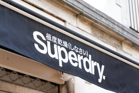 Bordeaux, Aquitaine / France - 08 04 2020: Superdry logo text and sign on store of london British...