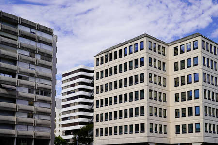 new modern buildings with facade corner and sky in real houses on line for office and apartmentの写真素材