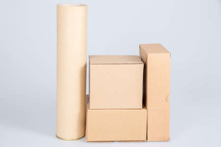 piles of many cardboard boxes and tube on a white background