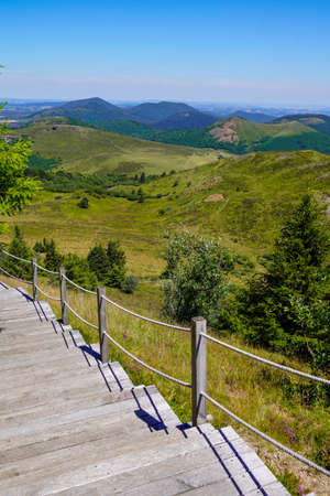 wooden pathway tour staircase for access easy on hight mountain Puy de DÃ´me volcano in Auvergne franceの写真素材