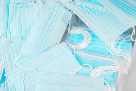surgical masks wallpaper in top view on flat lay blue backgroundの写真素材