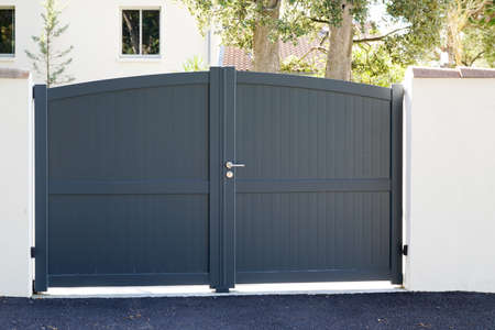 Aluminum home gray steel gate portal of suburb house