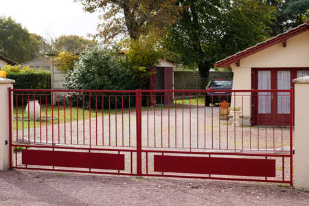 dark red retro design metal aluminum gate of modern houseの写真素材