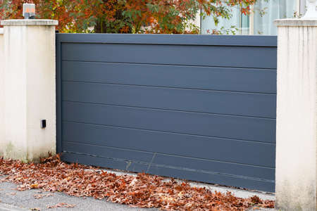 Aluminum gray metal sliding modern gate of suburb house