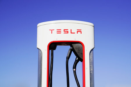 Bordeaux, Aquitaine / France - 11 11 2020: tesla supercharger car station charger power supply for electric cars vehicle in blue sky backgroundのeditorial素材