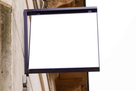 blank shop signboard on the city street. White square store sign on wall Mock upの写真素材
