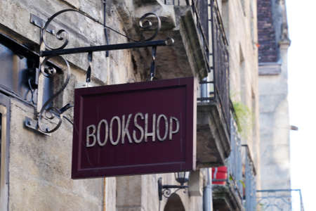 bookshop text sign on steel plate vintage signage front of bookstore in city street european city