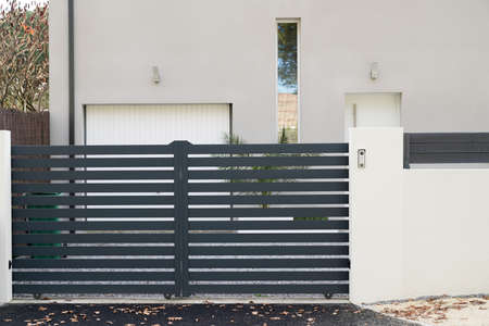 entrance gray gate aluminum portal home door of private houseの写真素材