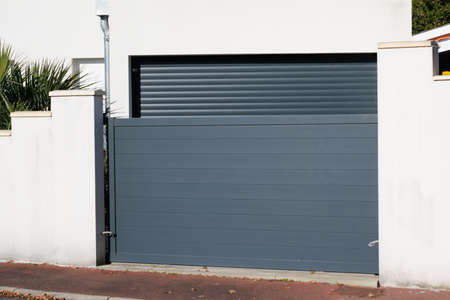sliding portal large metal gate gray fence on suburb street house door