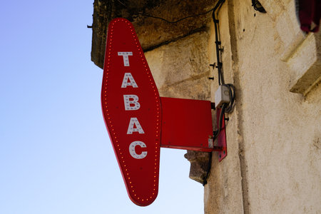 Bordeaux, Aquitaine France - 11 21 2020: tabac red light sign of French shop logo for tobacco with white text on wallのeditorial素材