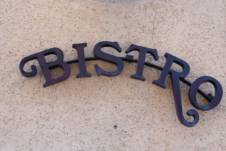bistro text sign word french means bar cafe on building city street restaurantの写真素材