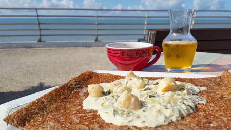 Bordeaux, Aquitaine France - 12 28 2020: kerisac bowl of french cider with a Breton crepe complete on the terrace seaside restaurant seaのeditorial素材