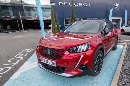Bordeaux, Aquitaine France - 01 05 2021: Peugeot e 2008 new hybrid electric car parked front of french dealershipのeditorial素材