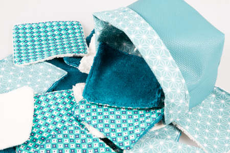 make up fabric removal washable cotton cosmetic home made diy pads in basket hande made isolated on white backgroundの写真素材