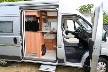 Bordeaux, Aquitaine France - 01 24 2021: Fiat ducato campereve brand RV holiday gray motorhome with slide side door open in camper vanのeditorial素材