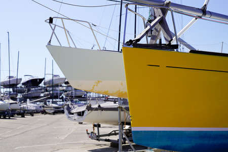 many boats yachts stored up in dry boat storage waiting for ship maintenance