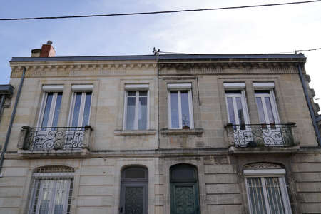 Difference between ancient wash cleaned old house building facades and a dirty one before and afterの写真素材