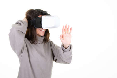 Smiling woman wearing virtual reality goggles headset box new generation progress concept trying to...