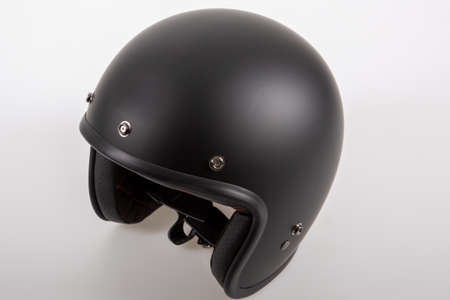 black open face vintage motorcycle helmet neo-retro style motorbike on gray backgroundの写真素材