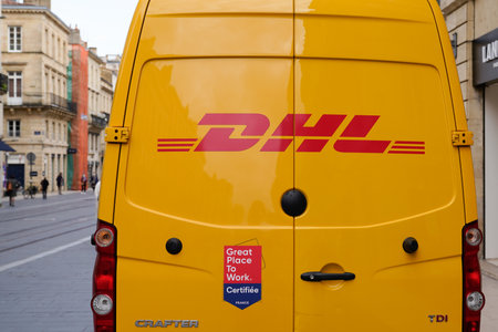 Bordeaux, Aquitaine France - 02 16 2021: DHL logo brand and sign on yellow delivery van car courier...
